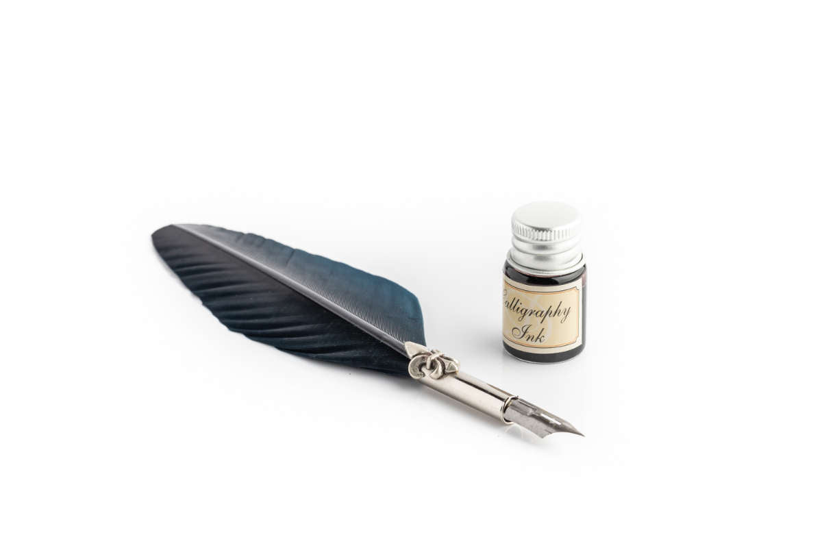 Writing set with blue large feather pen, lily decorated ferrule & black ink